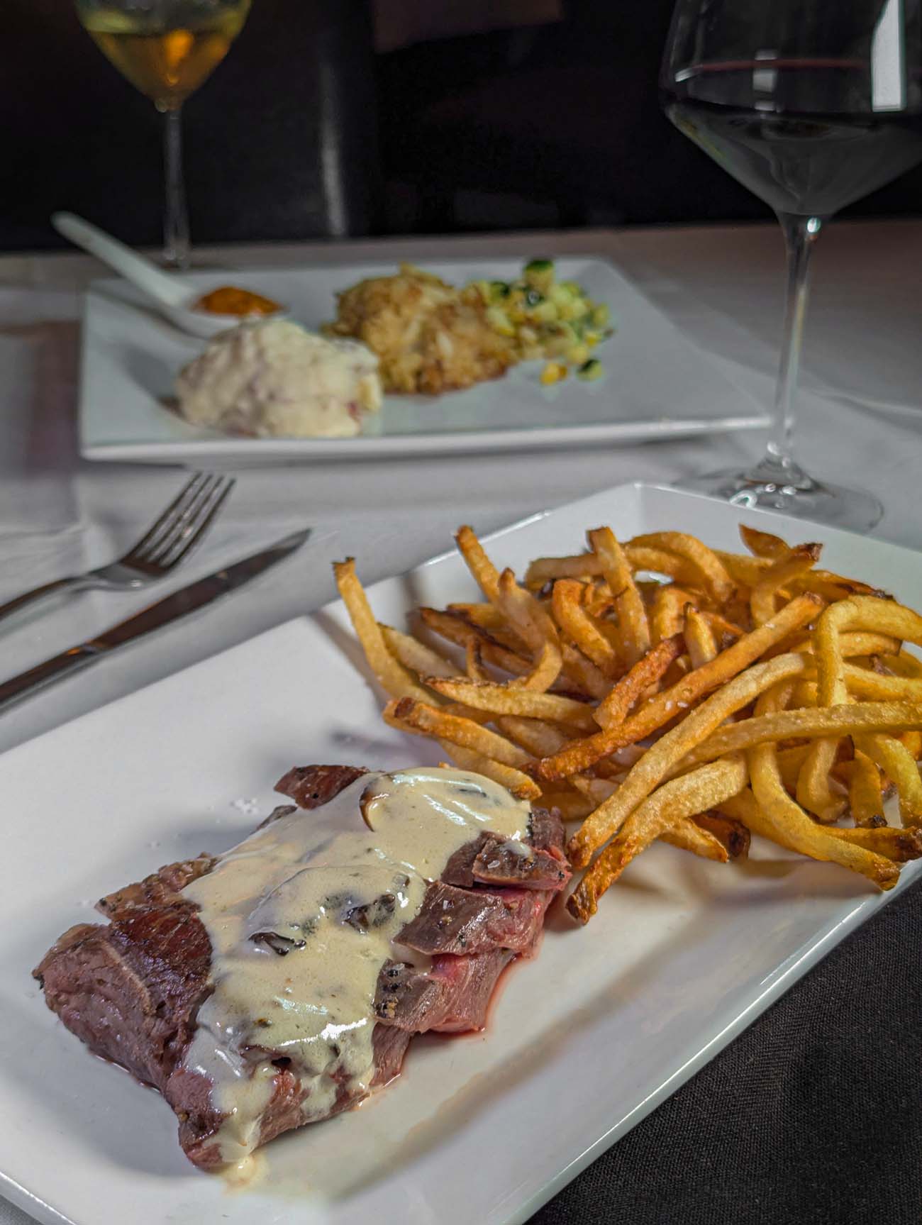 The Kitchen at the Imperial's signature hand-butchered flank steak, sous vide for six hours and sliced medium-rare, served with homemade shoestring fries and tarragon mushroom cream sauce.